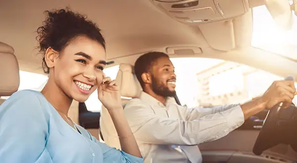 Couple driving car